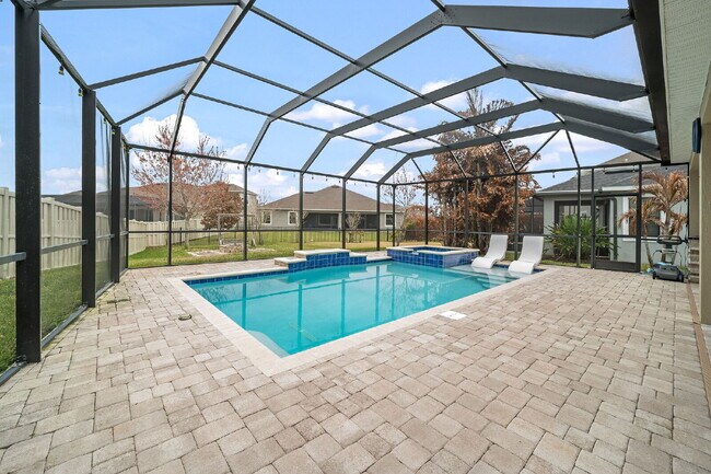 Building Photo - 4BR, 2.5BA home with resort style outdoor living!