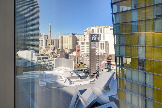 Building Photo - Stunning Strip Views from this Fully Furnished Studio Residence.