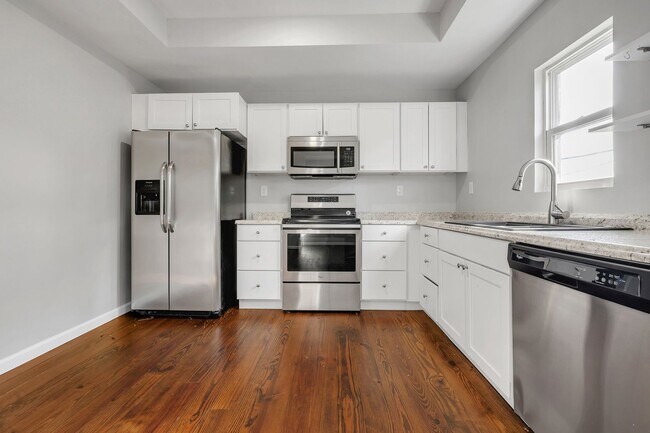 Building Photo - Modern Comfort Meets Prime Location — Styl...