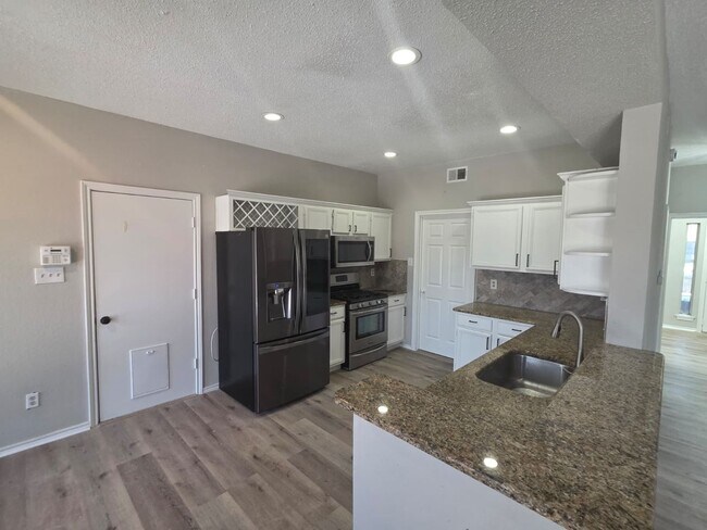 Building Photo - Spacious 4-Bedroom Home with Pool & Spa in...