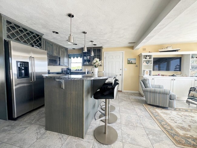 Building Photo - WINTER RENTAL Beach-front condo September ...