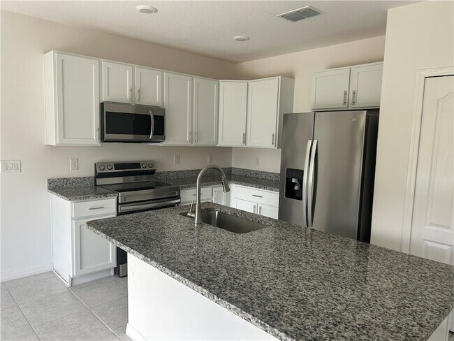 Building Photo - 8616 100th Ct