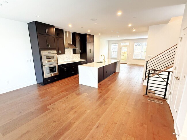 Building Photo - Brand new 4 level, 4 Bedroom Townhome with Elevator!