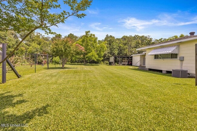 Building Photo - Timeless Charm in Ocean Springs’ Most Walk...