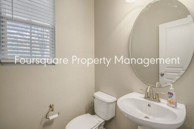 Building Photo - Charming Townhome with Open Layout, Back Patio & One-Car Garage – Near RTP, RDU & Everyday Conven...