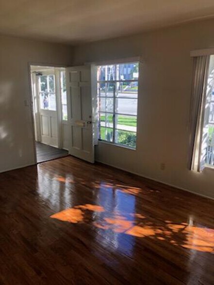 Living room looking at front door to apartment and front door to building - 1237 N Brand Blvd