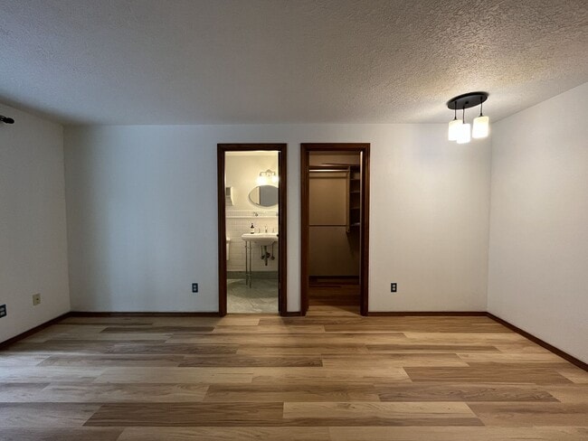 Building Photo - Spacious 3-Bedroom Home with Custom Stone Fireplace, Attached 2-Car Garage & Expansive Backyard i...