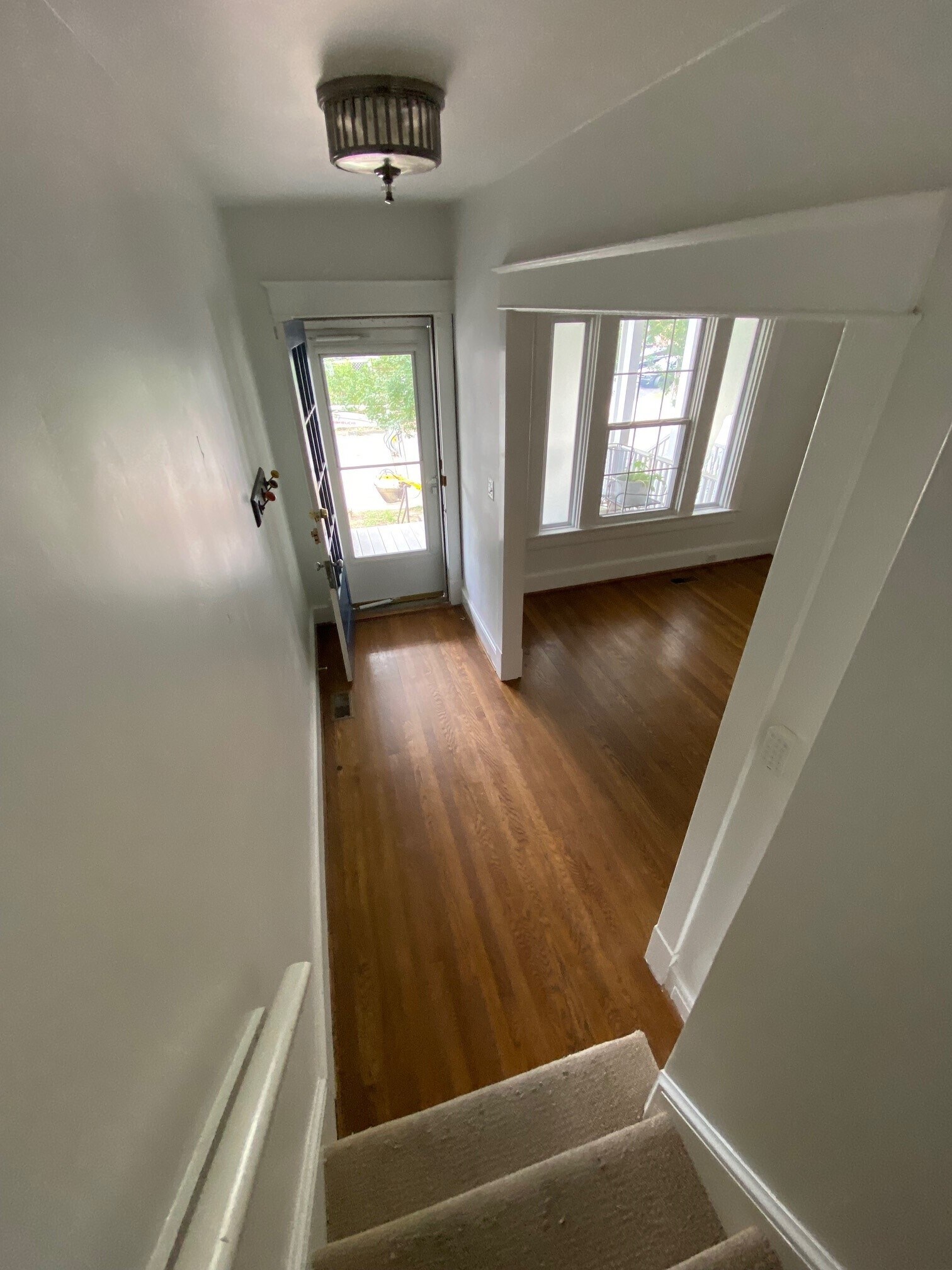 From stairs down to foyer and Living Room - 112 N Peyton St