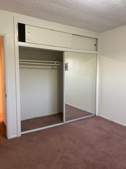 Bedroom #1; new carpet, full length mirror closet - 2458 S Normandie Ave