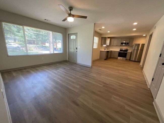 Building Photo - **Spacious 4BR with Modern Upgrades & Cove...