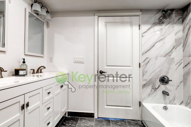 Building Photo - Modern New Construction 2 Bedroom Townhome with Garage & Driveway — First Occupancy!