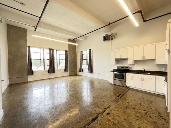 Fresh Look at Sunny Loft With Views And Laundry In Unit