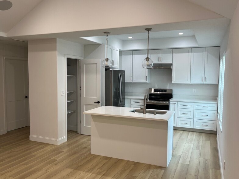 Kitchen with dishwasher and stainless steel appliances - 604 E 42nd St