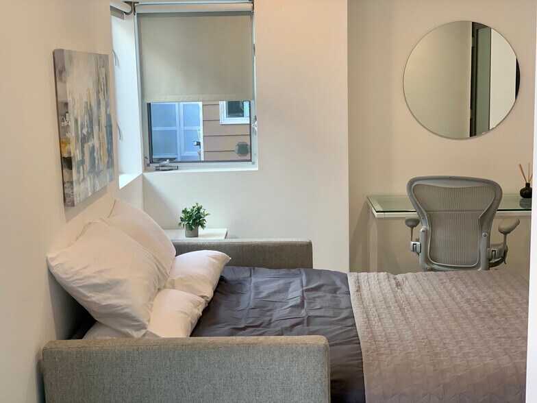 1st Floor guest room / office with a comfortable pull-out sofa. Sliding Barn door & ensuite bathroom - 7197 Formosa Fusion Ct