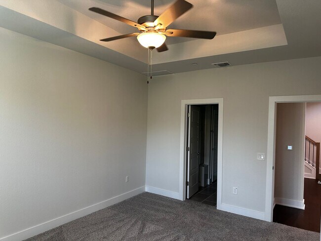 Building Photo - For Lease – Modern 2023 Condo Backing to Greenbelt | Creekside at Pioneer Crossing West