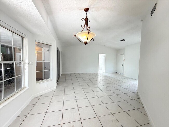 Building Photo - 9850 W Heather Ln