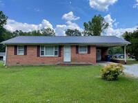 Building Photo - 3 BDRM 1 BA BRICK HOME, SINGLE CARPORT, 10...