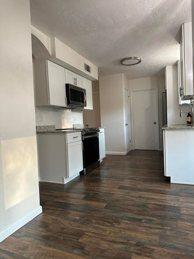 Building Photo - Move-In Ready Corner-Lot Home with Wraparound Porch Near Fort Eisenhower