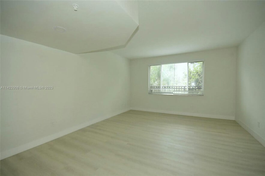 Living room with newly renovated tile floors - 705 SW 148th Ave