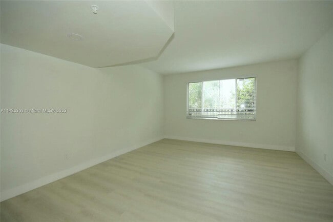 Living room with newly renovated tile floors - 705 SW 148th Ave