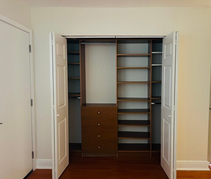 Front bedroom has put a laminate floors in California closets - 8601 SW 94th St