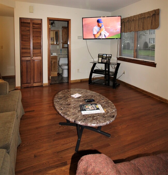 New hardwood floors and large flat screen TV - 115 River St