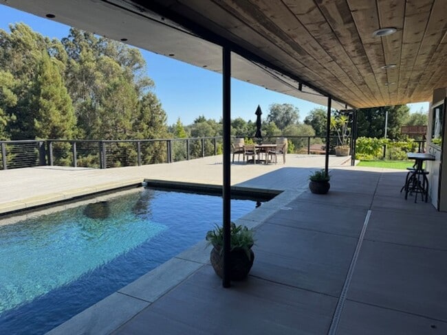 Building Photo - Stunning Deck and Pool for this Updated Mi...