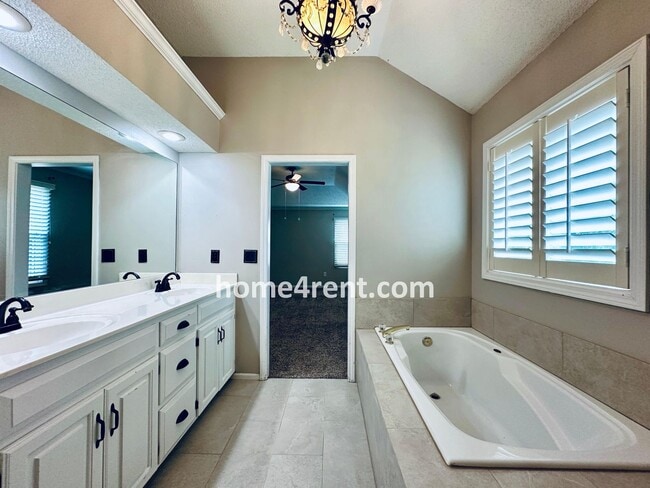 Building Photo - Updated Kitchen, Large Two Tiered Deck, Finished Basement in Blue Valley Schools!