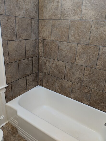 Fresh and clean new tile in bathroom! - 1111 Watauga St