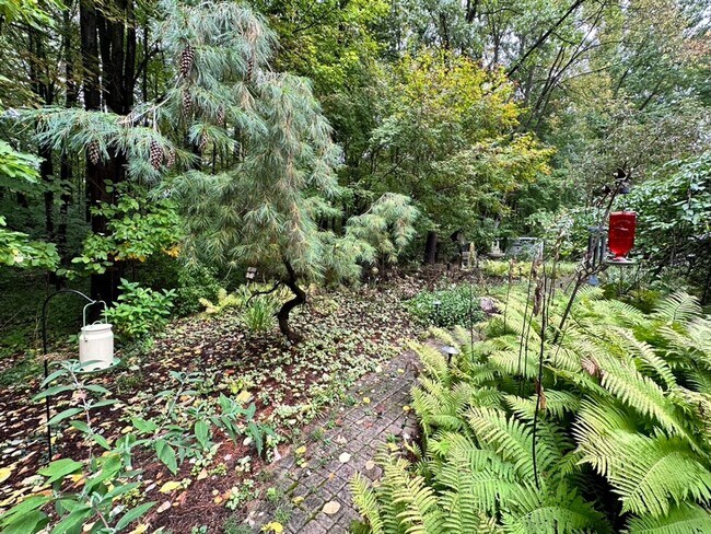 Building Photo - Dream Home in Highland, Michigan: Your Private Oasis on 5 Wooded Acres