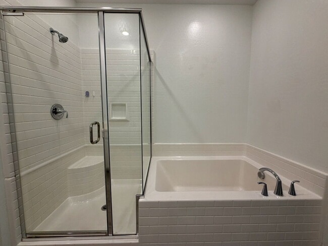 Building Photo - GATED 3 BED 2.5 BATH TOWNHOME WITH 2-CAR GARAGE, COVERED PATIO & COMMUNITY POOL