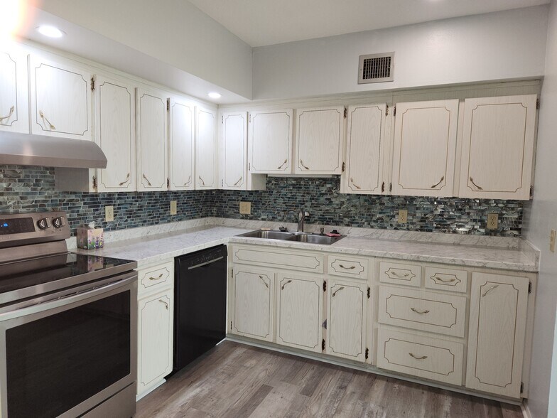 New range, counter and backsplash - 2380 World Parkway Blvd
