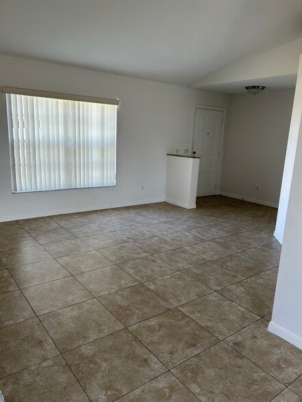 Building Photo - 6480 NW Volucia Dr