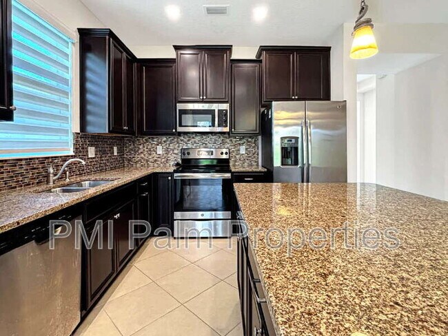 Building Photo - 9870 SW Trumpet Tree Cir