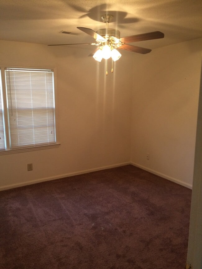 Building Photo - Brick Home with Carport & Fenced yard