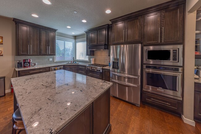 Building Photo - Four Bedroom Home + Bonus & Den in Gated C...