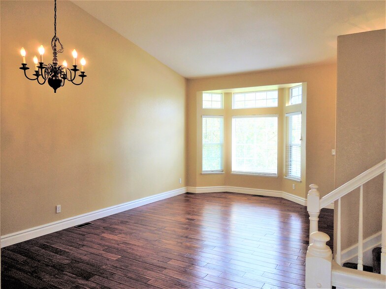 Spacious living room with solid hardwood floors - 16441 Martingale Dr