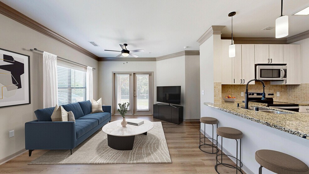Newly Renovated Living Room with Gorgeous Hardwood-Style Flooring - Avenues at Craig Ranch Apartments