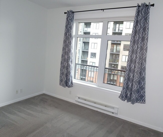 Building Photo - Chic 1-Bedroom Condo with Stunning City & ...