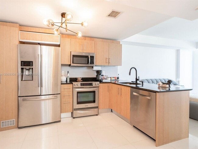 Building Photo - 10275 Collins Ave