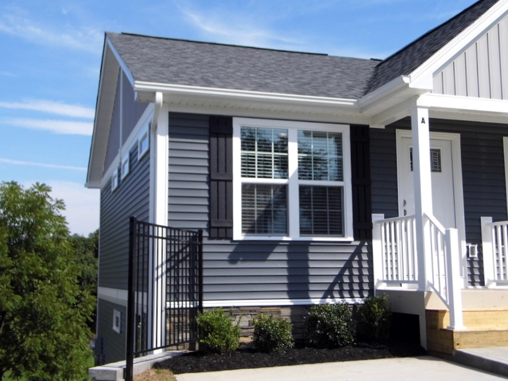 Large windows with plantation blinds offering abundant light, manicured beds - 2312-A Belle Ave NE