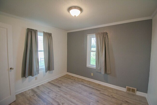 Building Photo - Fenced Yard, 2-Car Garage + Internet Included