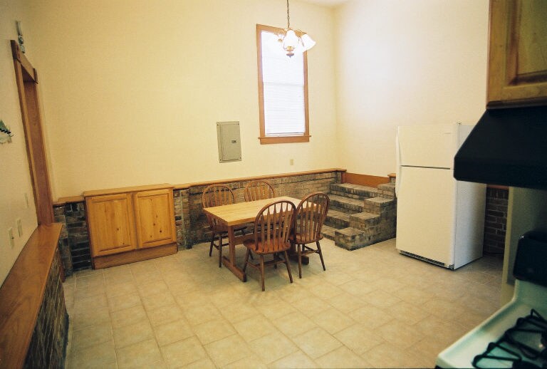 Dining area with original stairs to nowhere and bonus cabinet - 2039 Valence St