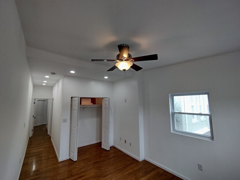 Third Bedroom _ Alternate View Another angle of the bright third bedroom, showcasing three large win - 1933 4th St NW