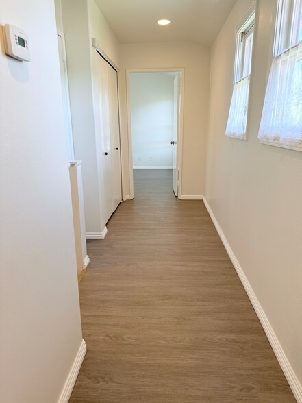 sunny upstairs hallway - 631 S Glassell St