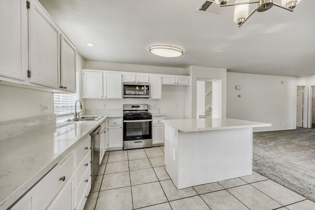 Building Photo - Fully remodeled!  Cozy 4 bedroom with 3 car garage !