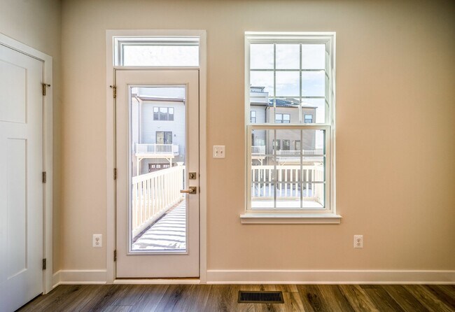 Building Photo - This 3-bedroom, 3-full bathroom townhouse offers a pristine and contemporary living experience.