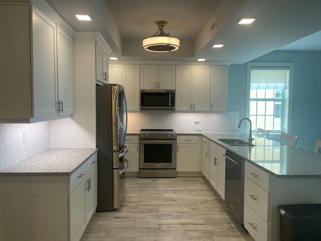 Building Photo - Coastal Luxury at Hidden Bay | 3BR Waterfront Condo with Bay Views