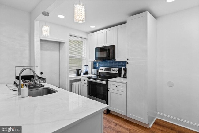 Building Photo - Welcome to this sunny and updated 4-bedroom, 2-bath row home in the heart of Mt. Airy! W/D! Large...