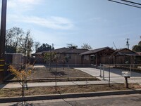 Building Photo - 4 bedroom 1 bathroom Pinedale home offerin...